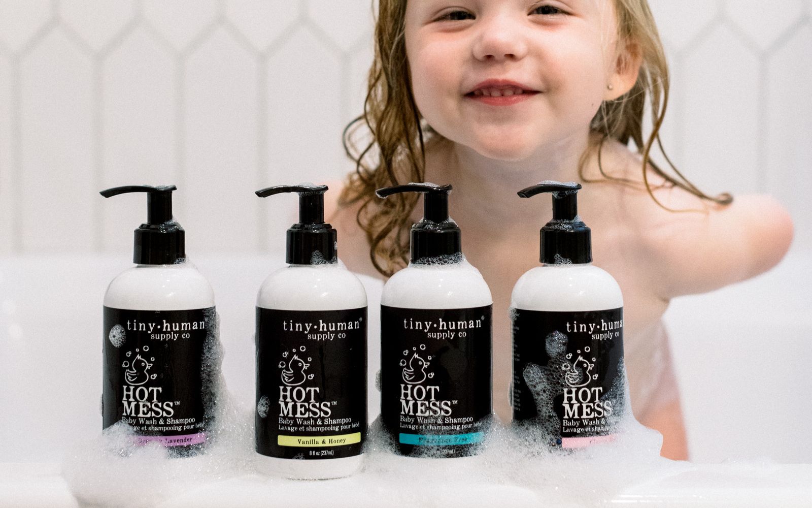 tiny human supply organic hot mess baby wash and shampoo in bubble with with happy toddler