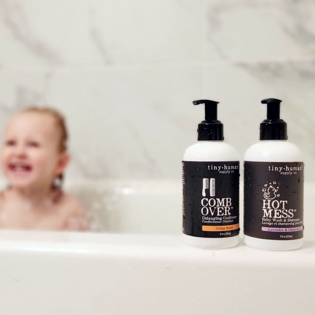 toddler in bath with comb over conditioner and hot mess baby shampoo