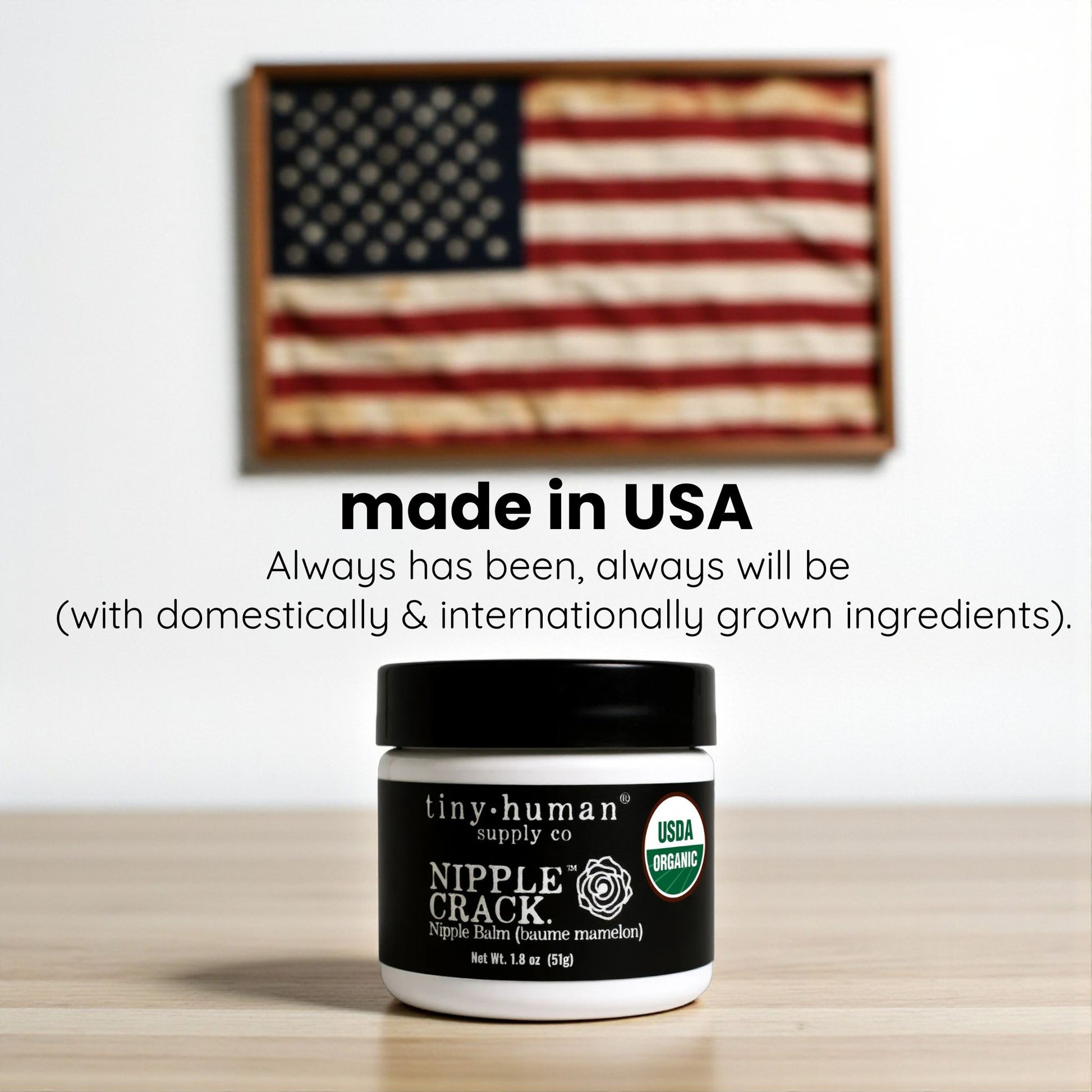 Jar of 'Nipple Crack' balm with an American flag in the background