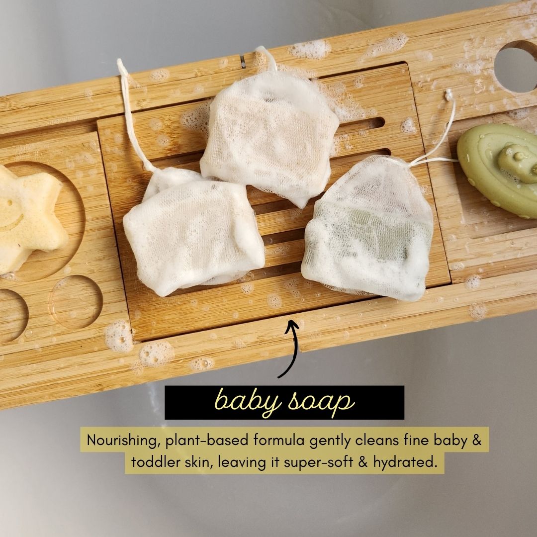tiny human supply make a splash baby soap and shampoo bars in bathtub with baby toys