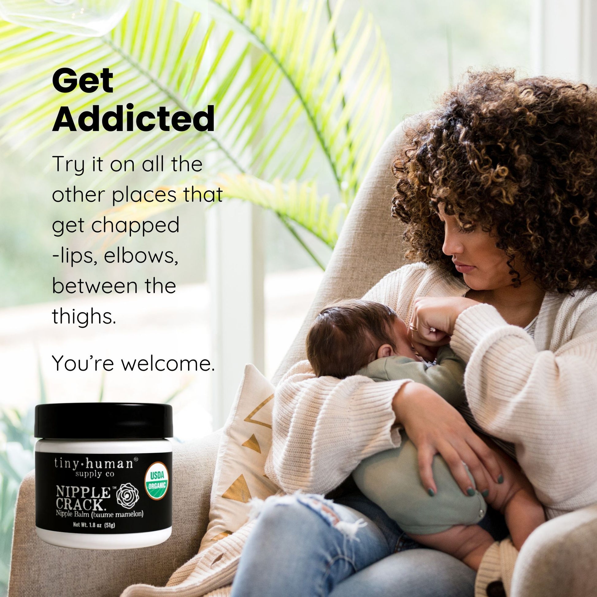 Woman holding a baby with a bottle of nipple crack cream in a cozy setting.