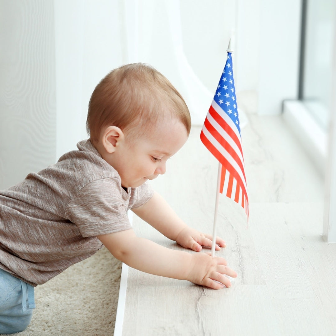 Baby holding USA flag with organic skincare